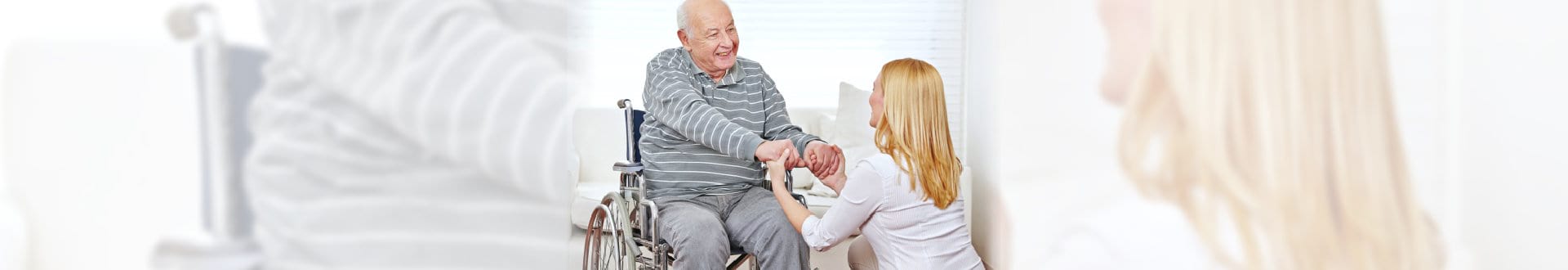 caregiver and senior man holding hands